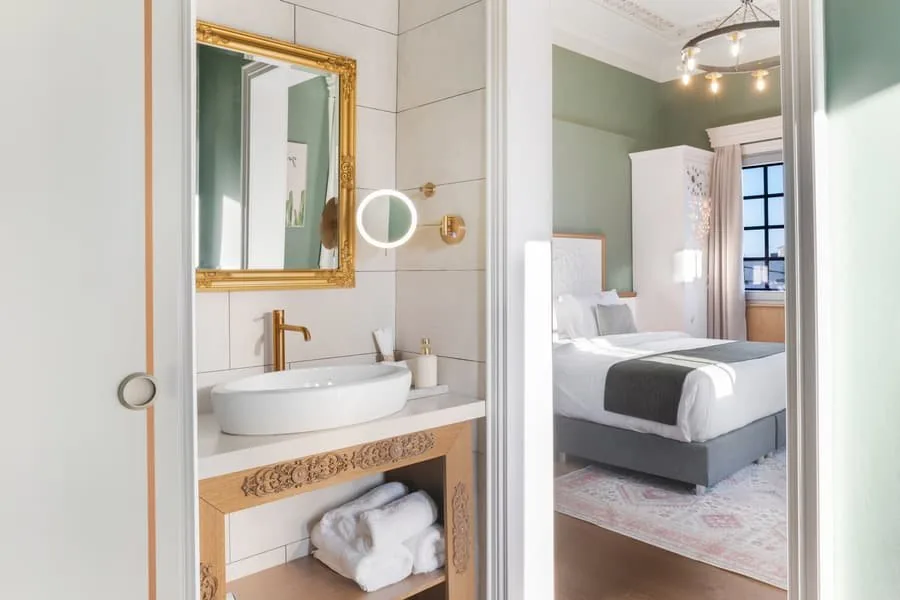 A gilded mirror in the bathroom