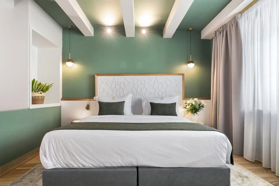 A bed under timber beams
