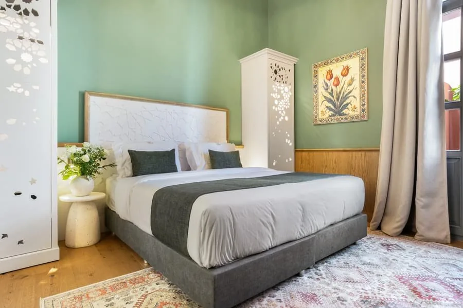 A bed with a tulip painting