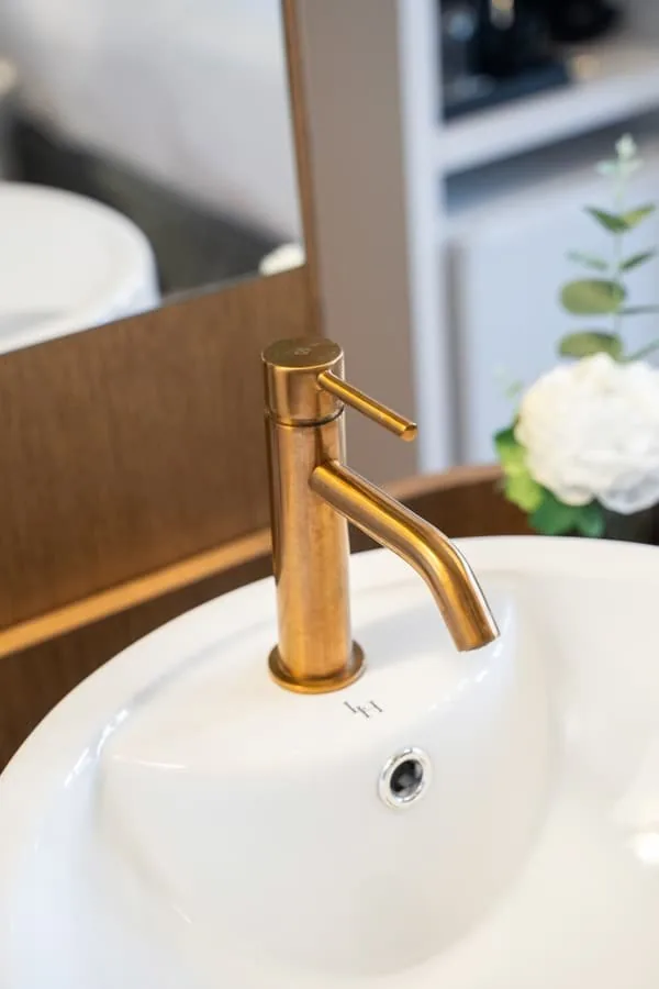 A tap in matt gold