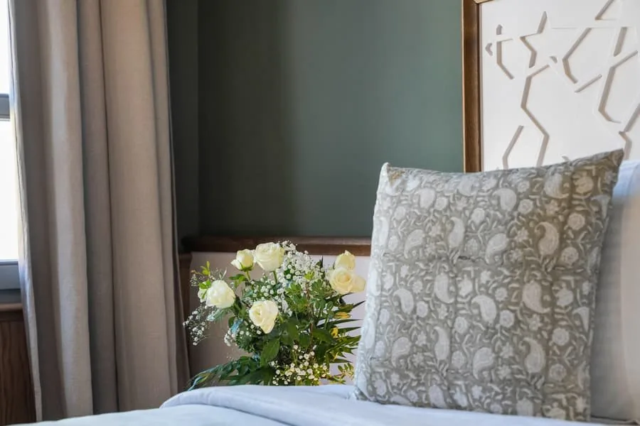 A cushion and flowers