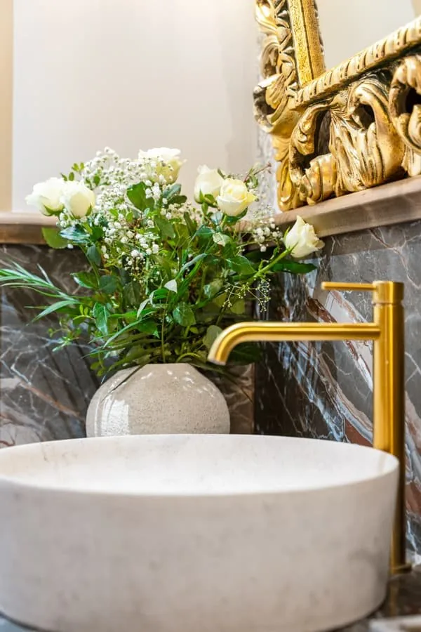 A stone basin with roses