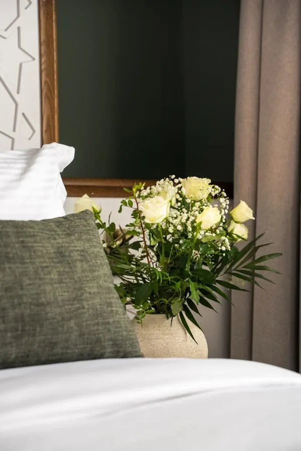 White roses on the bed