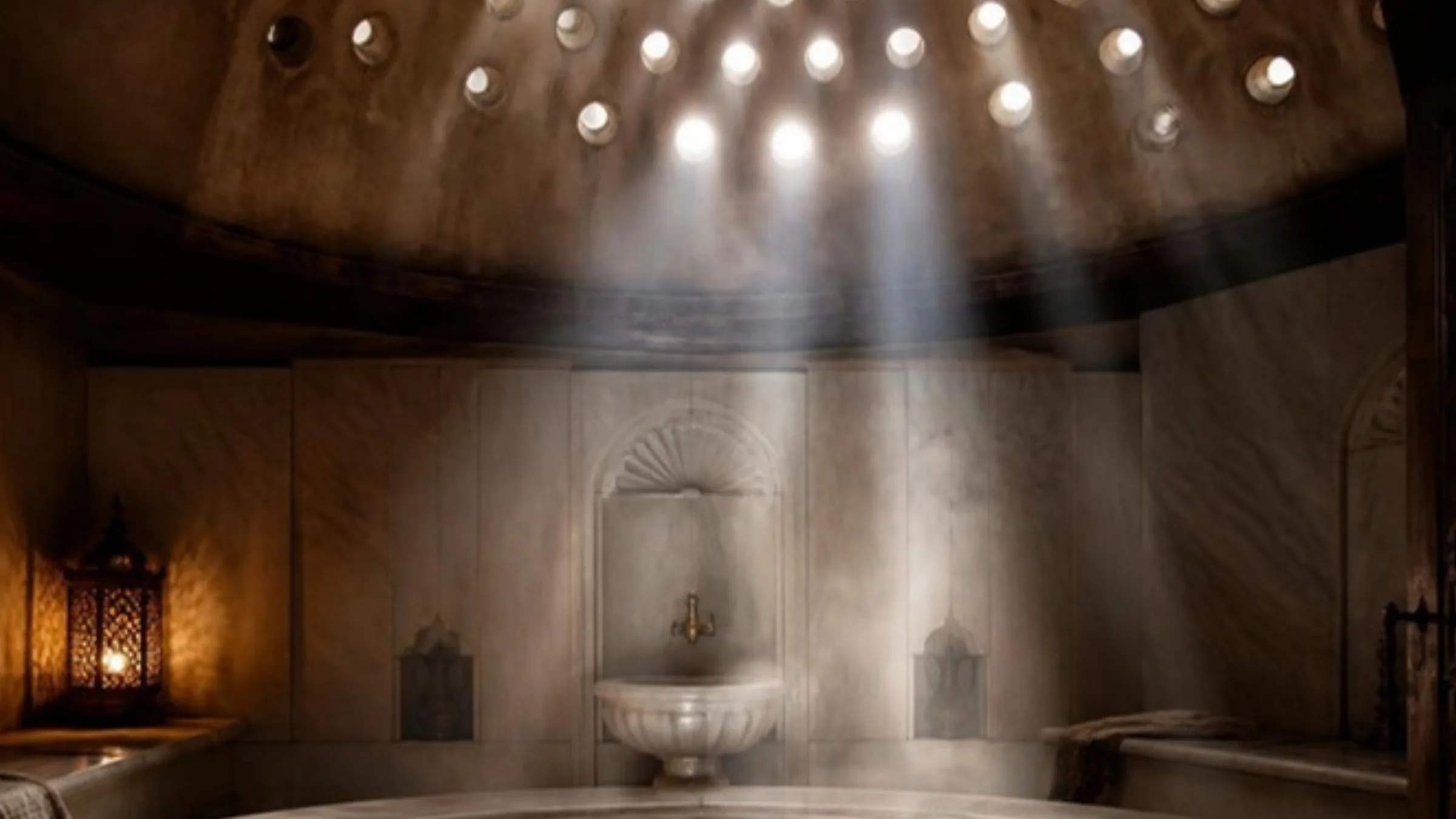 The dome of the hammam and the shafts of light through the steam